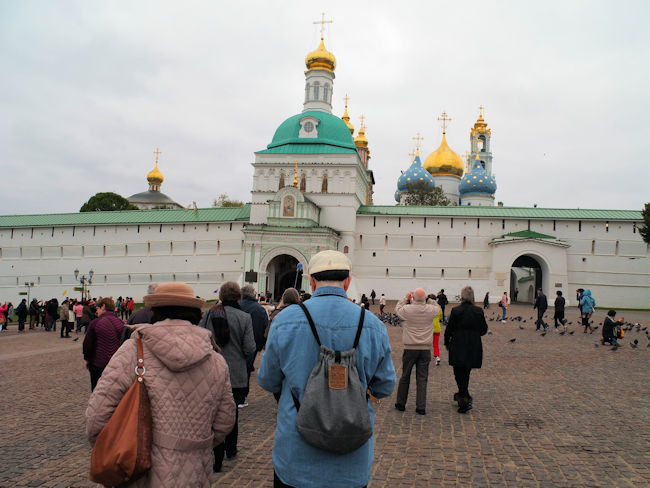  Tourists and pigeons before the Monastery Gate.jpg 